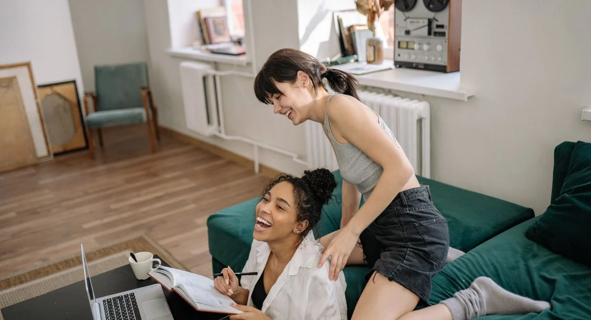 Happy couple enjoying each other's company while working from home.