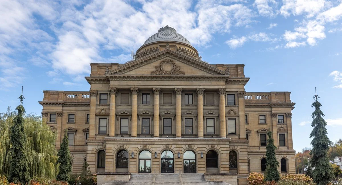 Front view of Luzerne County Courthouse, Wilkes-Barre, under a blue sky.
